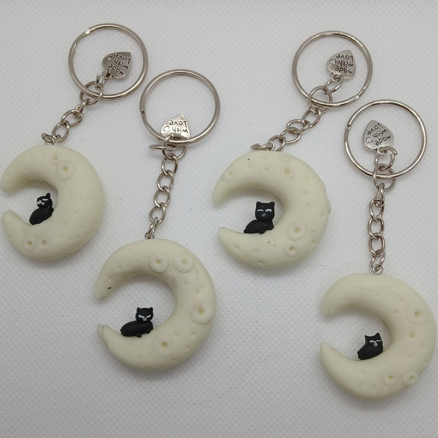 glow-in-the-dark cat in the moon polymer clay keyring