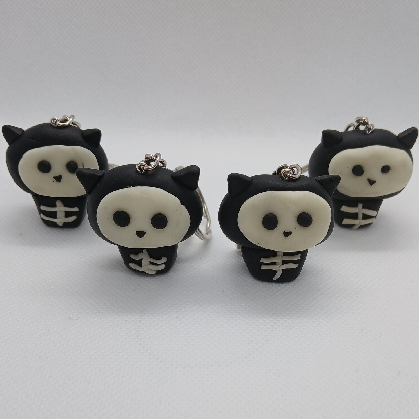 glow-in-the-dark skeleton cat polymer clay keyring