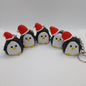 penguin in a Santa hat polymer clay keyring